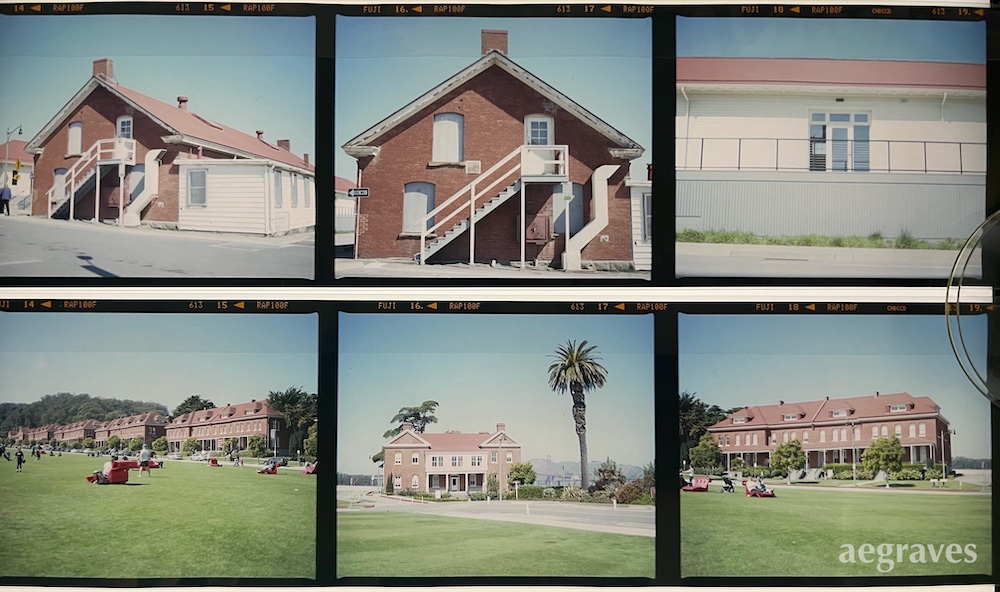 View of two positive film strips of historic buildings on a light table