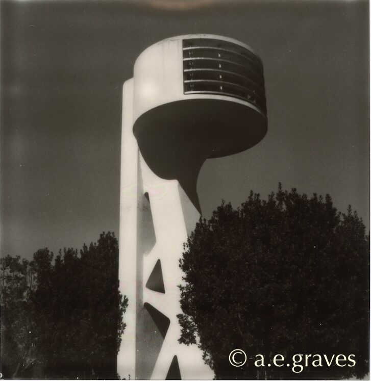 Polaroid monochrome image of a microphone-shaped tower