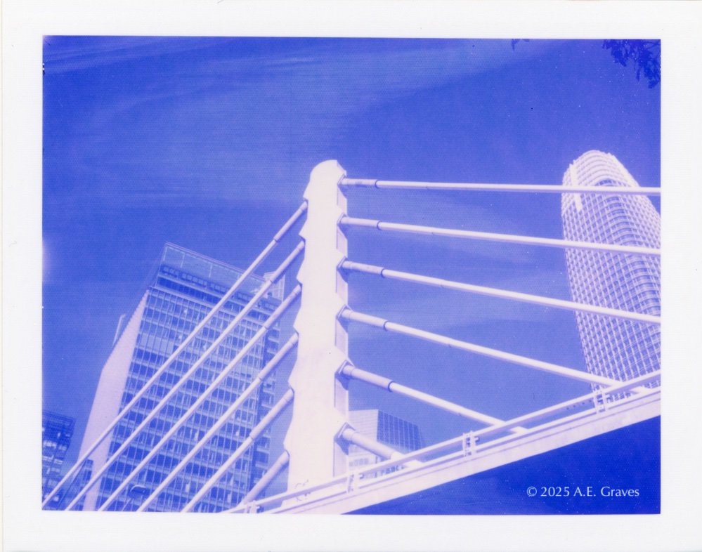 Blue toned image of the bridge at Salesforce Transit Center
