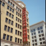 Red Golden Gate Theater marquee on a sunny day with a pale blue sky