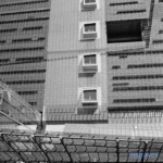Black and white image of canopies and a mesh facade at the San Francisco Federal Building by Morphosis