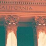 Orange and green image of corinthian columns at the Bank of California