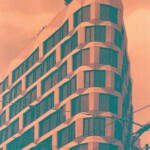 Orange and green image of a highly faceted corner of a contemporary tall building