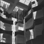 Monochrome image of a series of triangular walls in an antrium