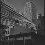 Monochrome cityscape with various textures of buildings, looking underexposed