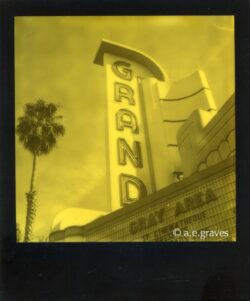 Monochrome black and yellow Polaroid image of the Grand theater marquee